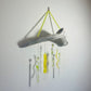 Alaskan Driftwood Chime with Yellow Glass on white background.