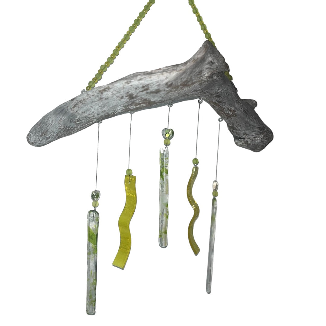Alaskan Driftwood Chime with Yellow Glass on white background. Close up image