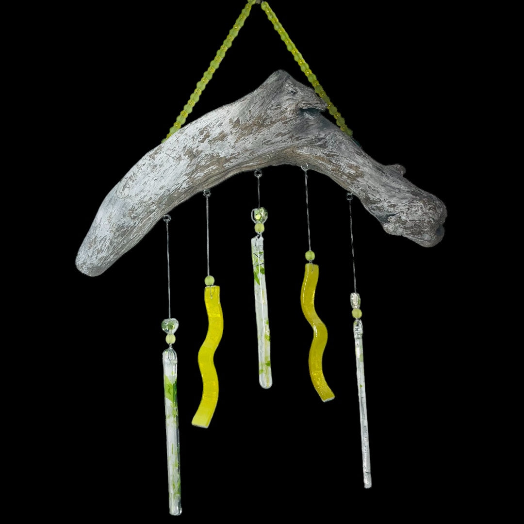 Alaskan Driftwood Chime with Yellow Glass on black background.