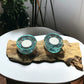 Driftwood Candle Holder with Aqua Colored Fire Glass and Tea Lights. Driftwood Decor on white table background.